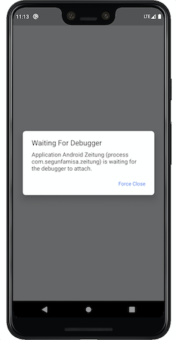 Screenshot showing the Android system waiting for debugger when debug app is launched